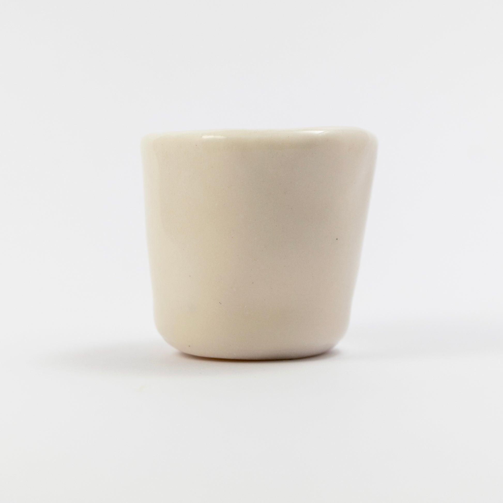 Plain white back side of the cup with no visible decoration.
