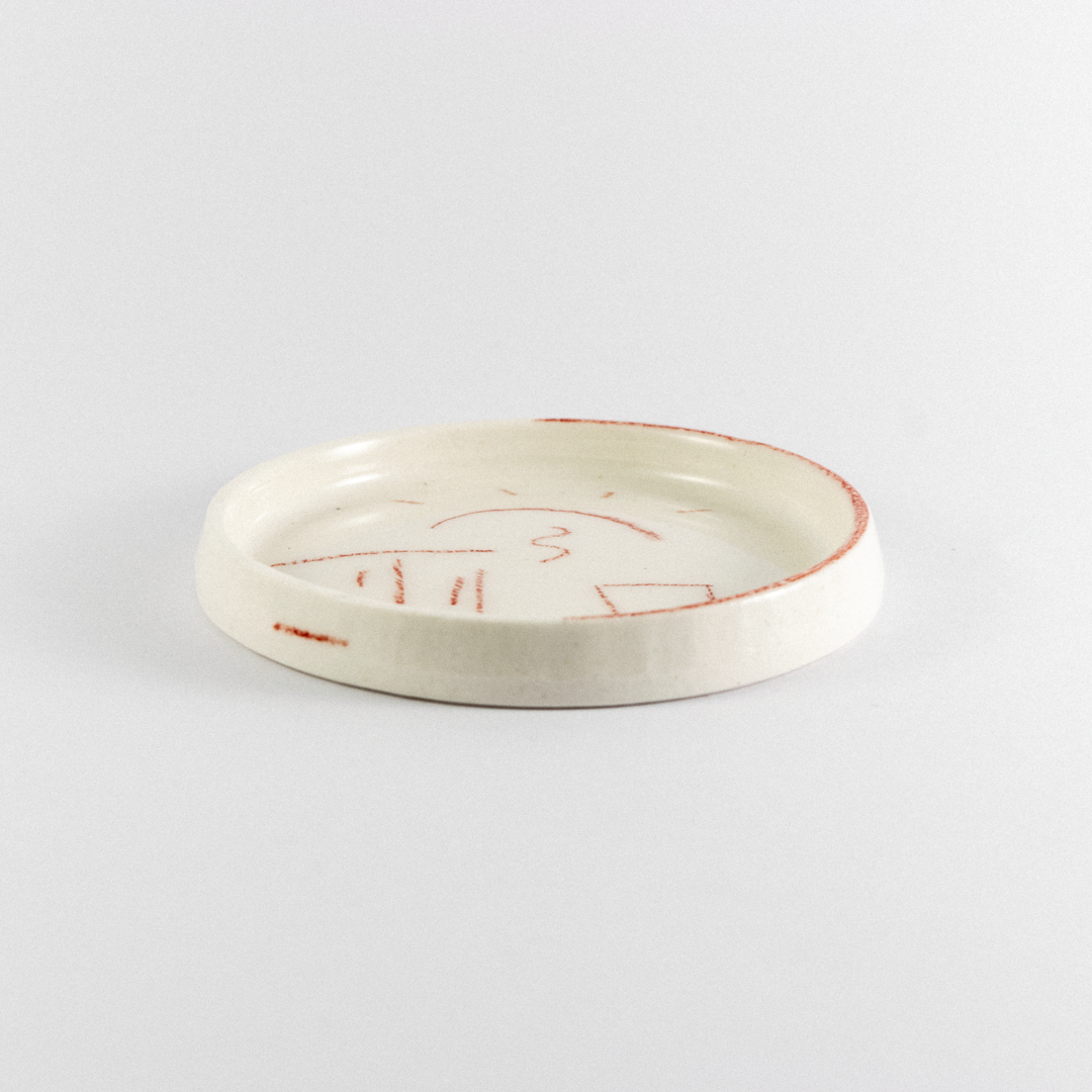 Porcelain trinket tray with rend hand drawn doodles.