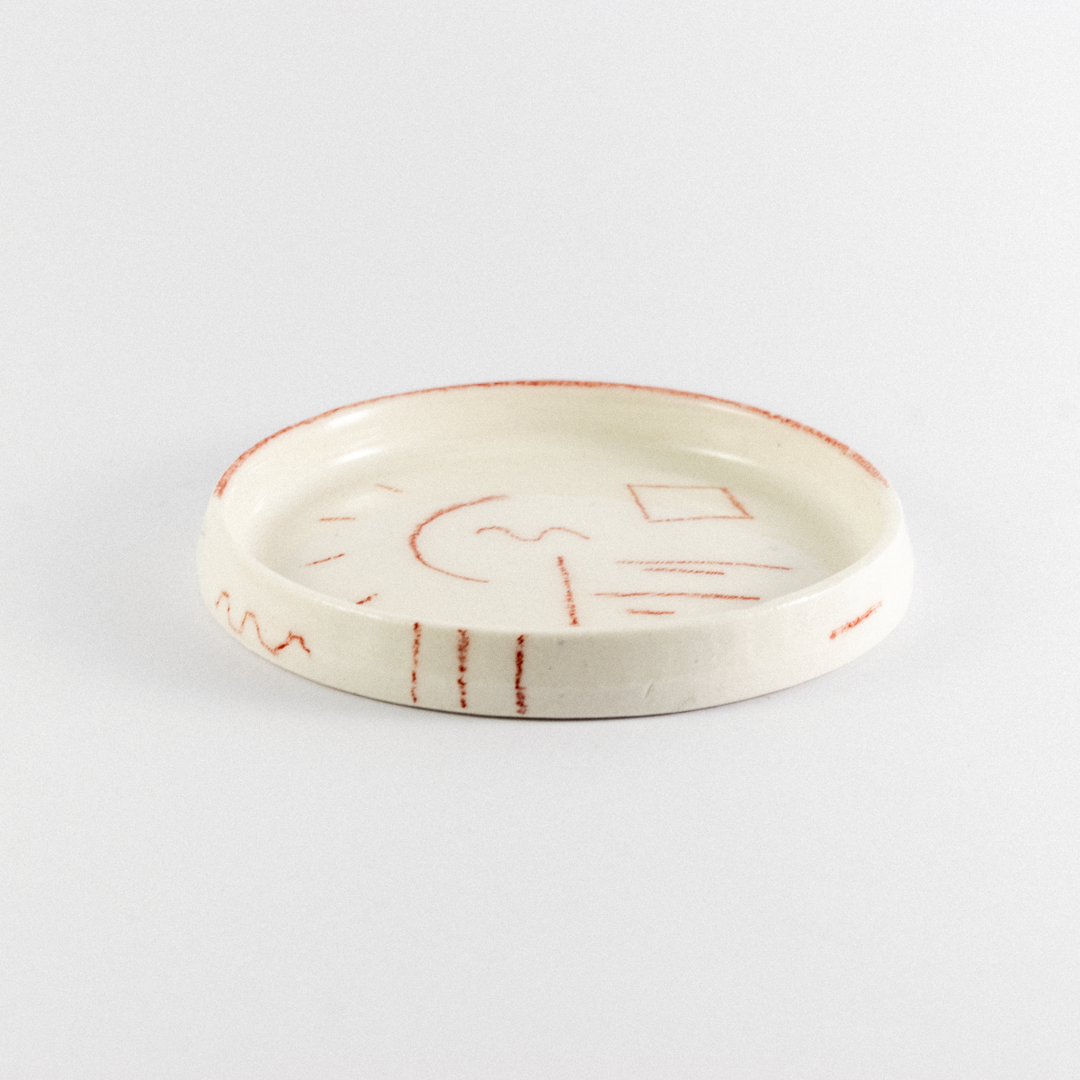 Porcelain trinket tray with rend hand drawn doodles.